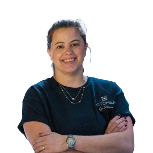 Vivian Koenig smiling with her arms crossed